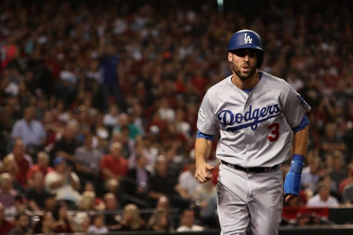 Chris Taylor scores on a ground out by Cody Bellinger during the first inning against the Diamondbacks in Game 3 of the National League division series.
