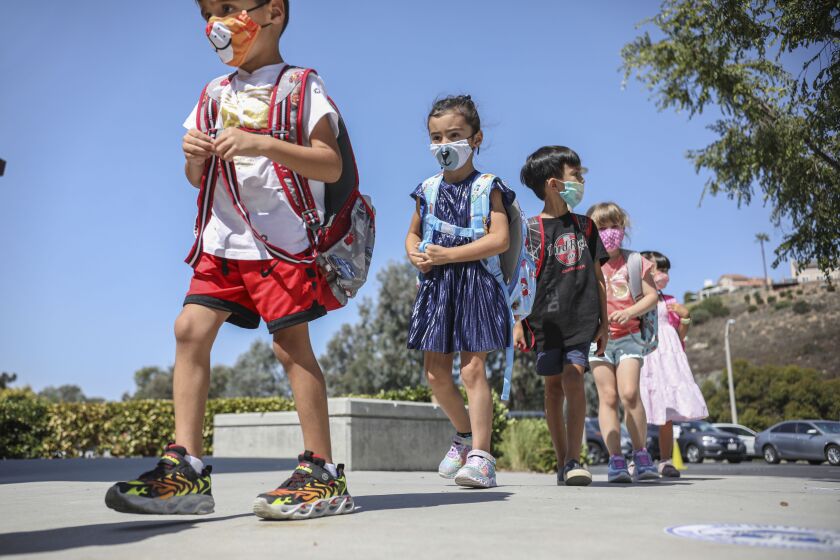 Kindergarten students walk to class at Sunset Hills Elementary School in Poway on Thursday, October 1, 2020.(Photo by Sandy Huffaker for The San Diego Union-Tribune)