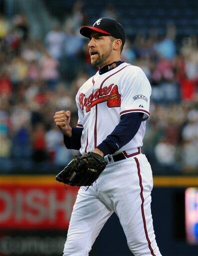 Atlanta Braves pitcher John Smoltz warms up before the first