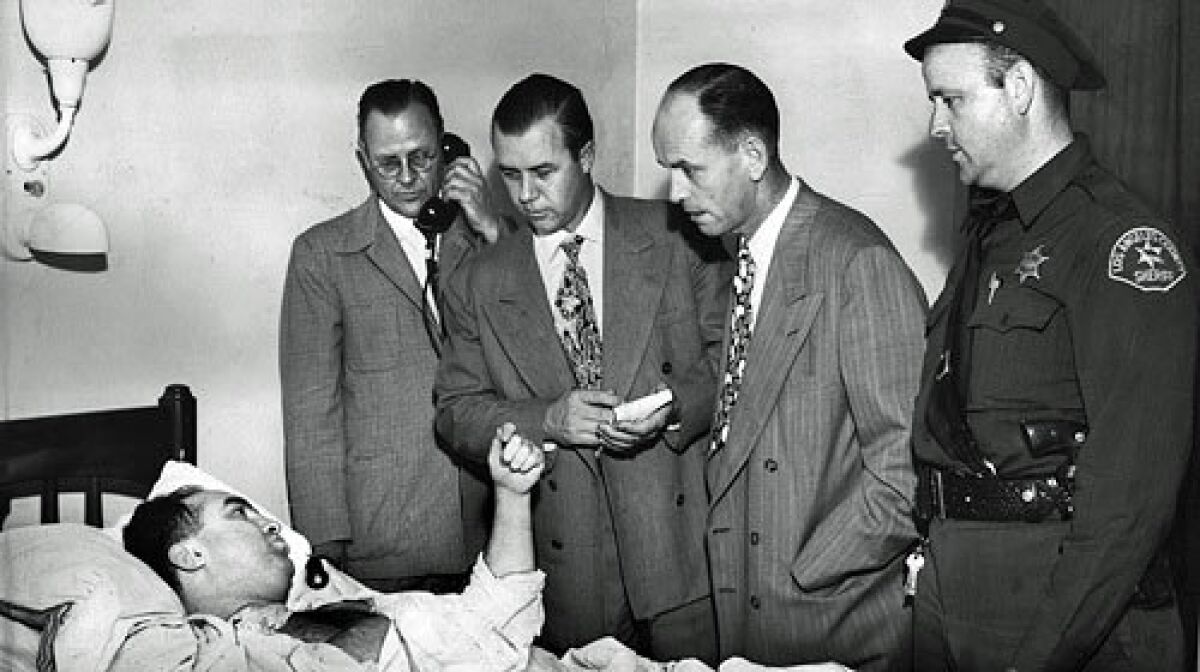 L.A. mobster Mickey Cohen tells officers in July 1949 of the shooting outside Sherrys cafe on Sunset Boulevard that left him with a wound to the shoulder and columnist Florabel Muir with a gunshot to her hindquarter.