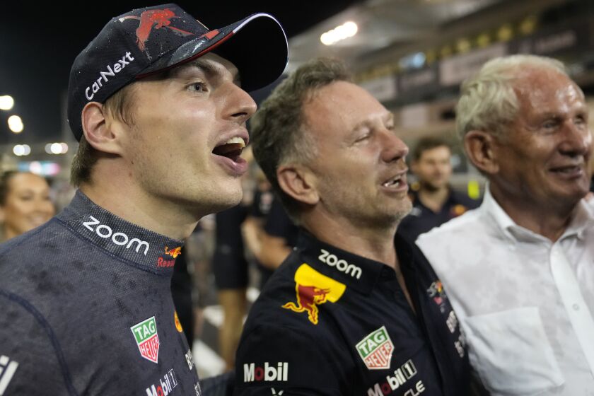 Red Bull driver Max Verstappen of the Netherlands and team's principal Christian Horner celebrate Verstappen's third championship title after the Formula One Abu Dhabi Grand Prix, in Abu Dhabi, United Arab Emirates Sunday, Nov. 20, 2022. (AP Photo/Hussein Malla)