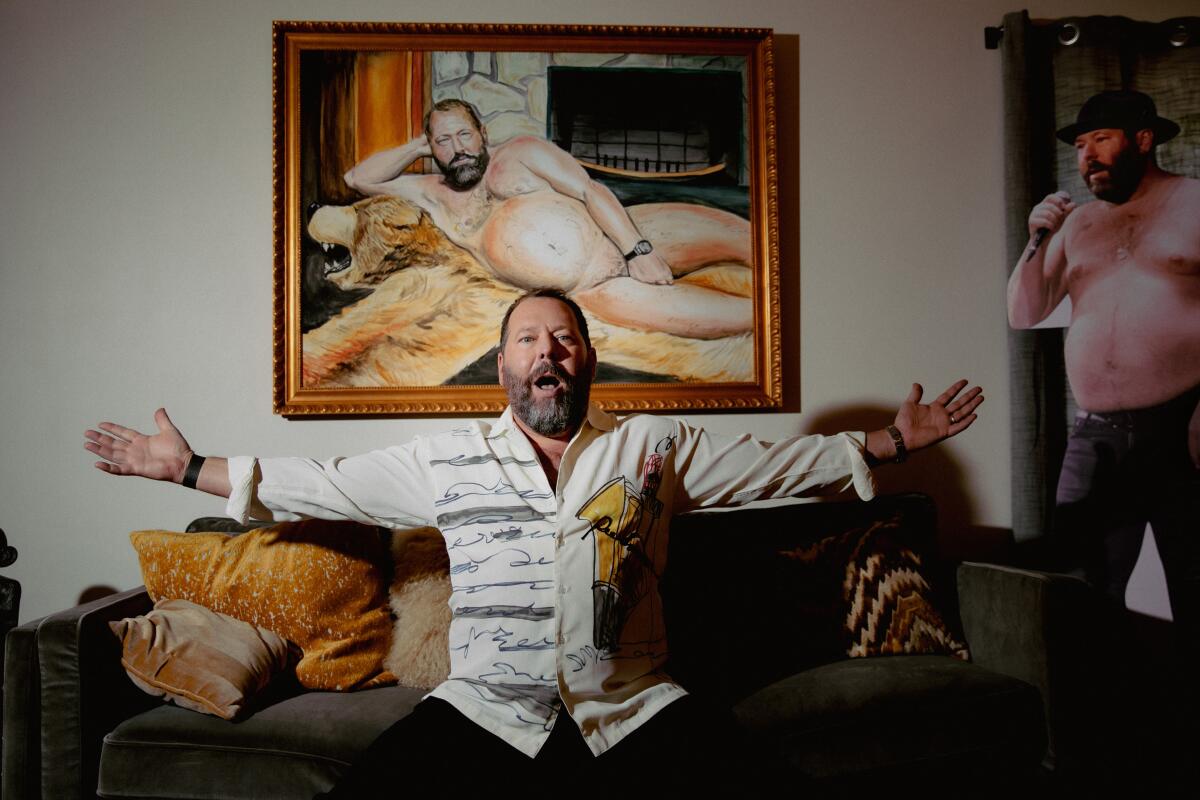 Man sitting on couch with arms stretched out