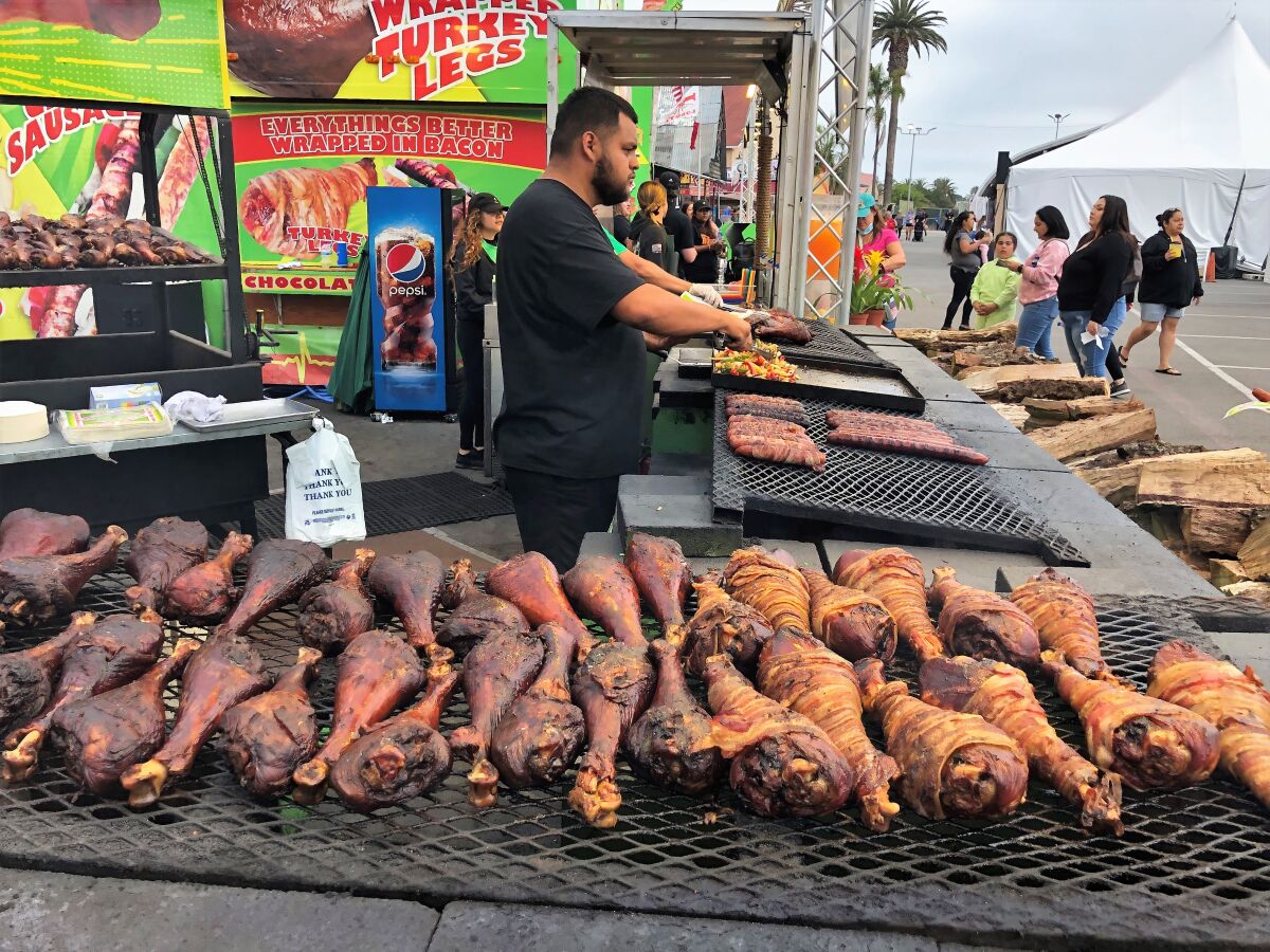 Bacon A-Fair specializes in roasted turkey legs with or without bacon wrapping at the 2022 San Diego County Fair.