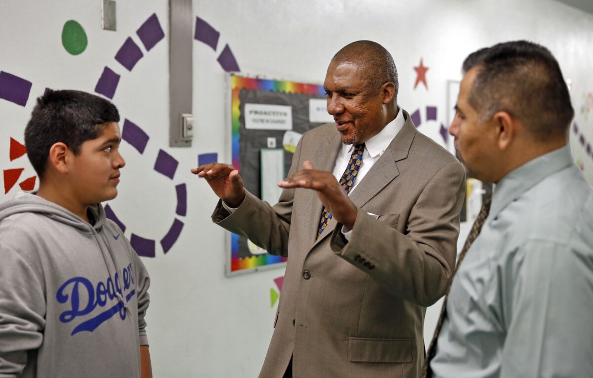 L.A. Unified School District Arts Education Executive Director Rory Pullens, center, visits Normandie Elementary School.