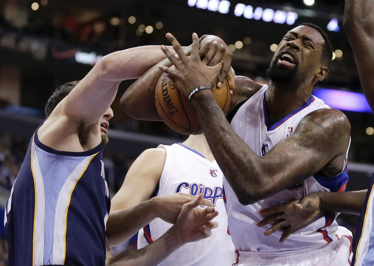 Center DeAndre Jordan, battling for a rebound against Grizzlies backup center Kosta Koufos, has been integral in the Clippers' winning streak since Blake Griffin underwent surgery.