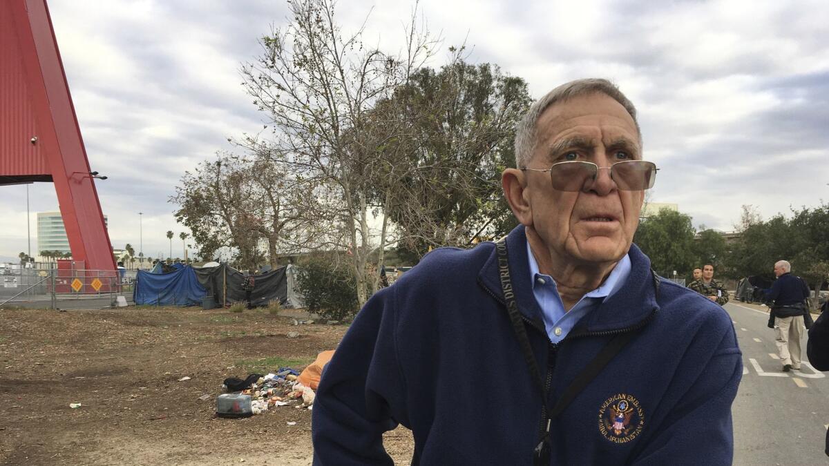 U.S. District Judge David Carter tours a homeless encampment in Santa Ana on Feb. 14.