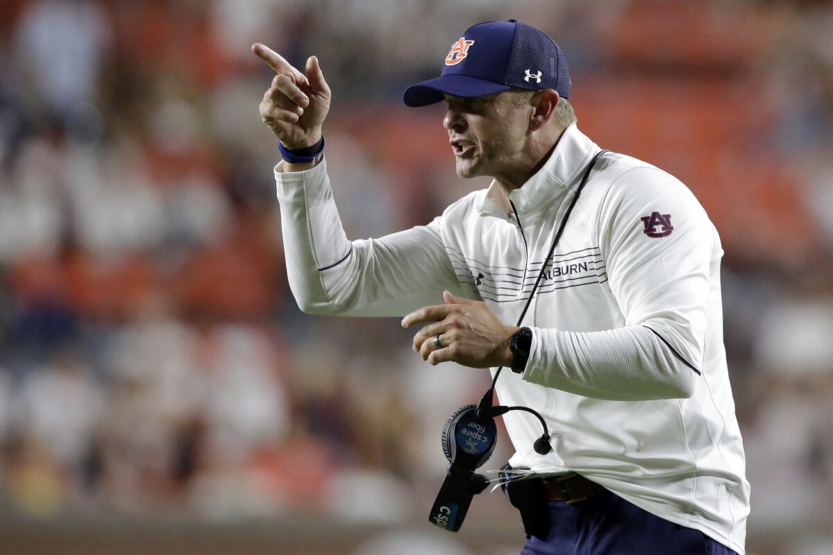 Auburn coach Bryan Harsin signals to players during the second half of an NCAA college football game against Akron on Saturday, Sept. 4, 2021, in Auburn, Ala. (AP Photo/Butch Dill)