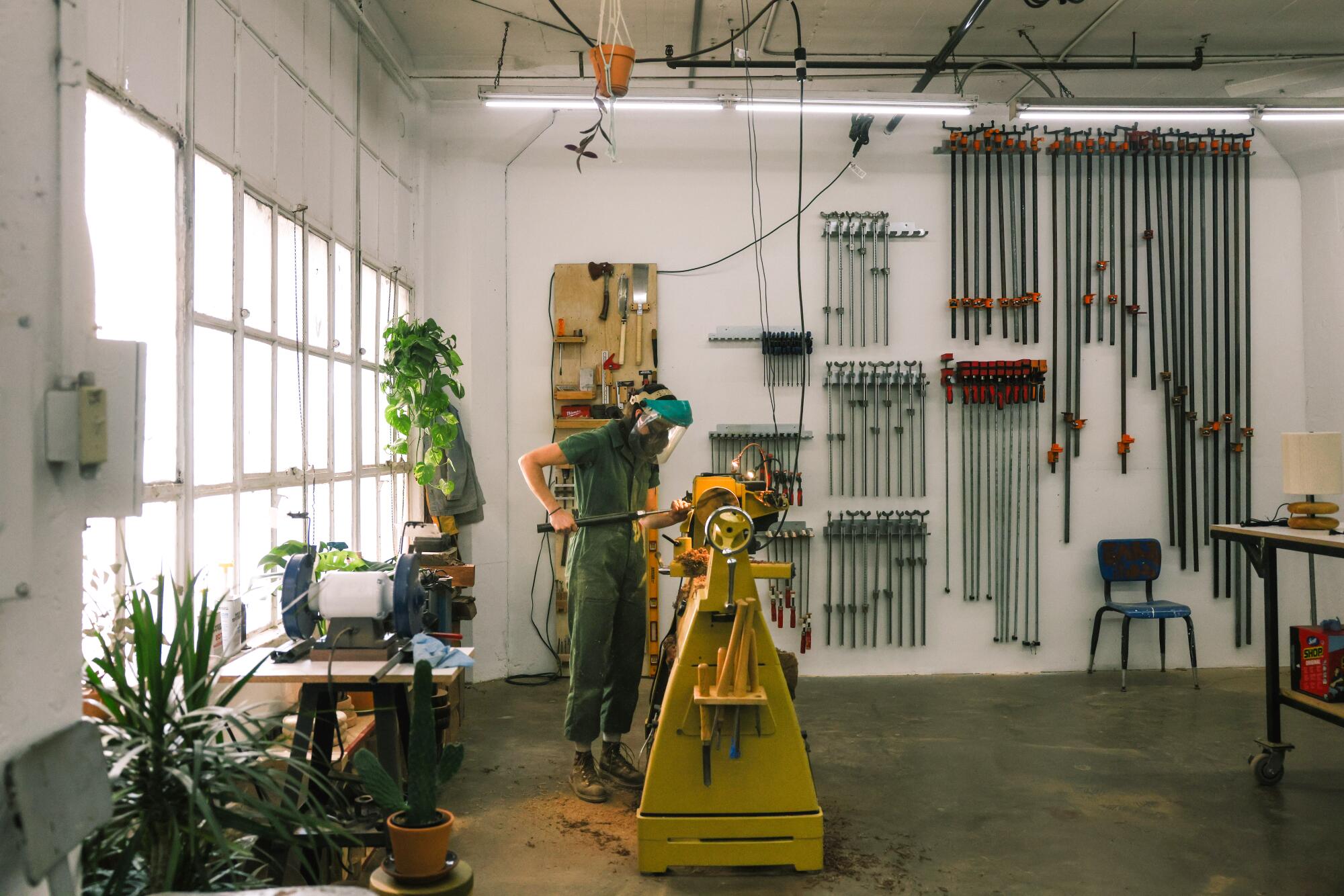 Julie Jackson of Surcle Wood turns a vase in her downtown L.A. woodshop.