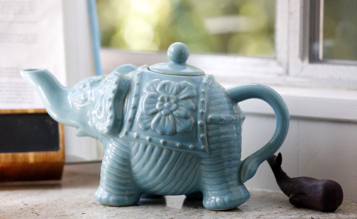 A teapot is part of the kitchen decor.