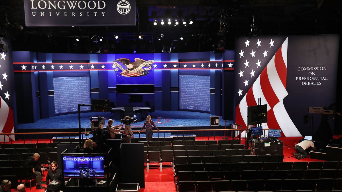 Final preparations are made on the set for the vice presidential debate at Longwood University in Farmville, Va.
