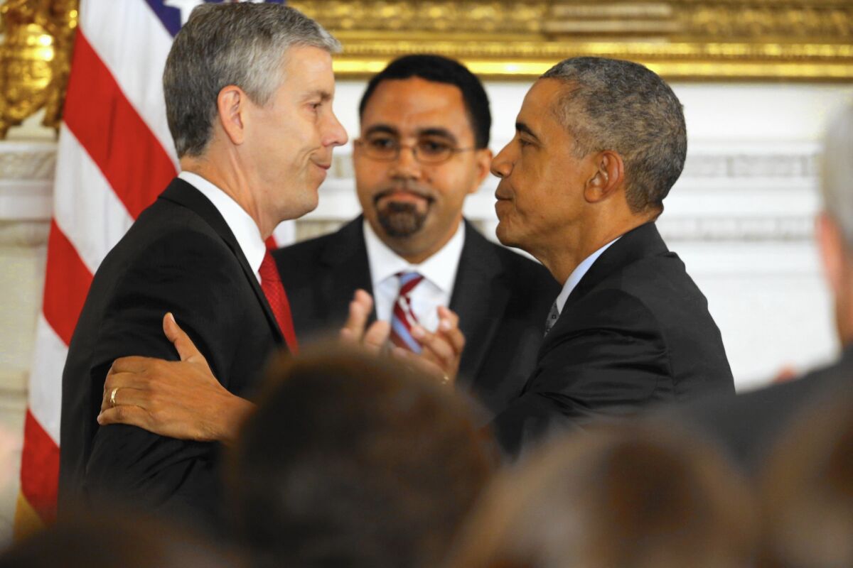 President Obama, right, named John King Jr., center, to replace Arne Duncan, left, when Duncan steps down as secretary of Education in December.