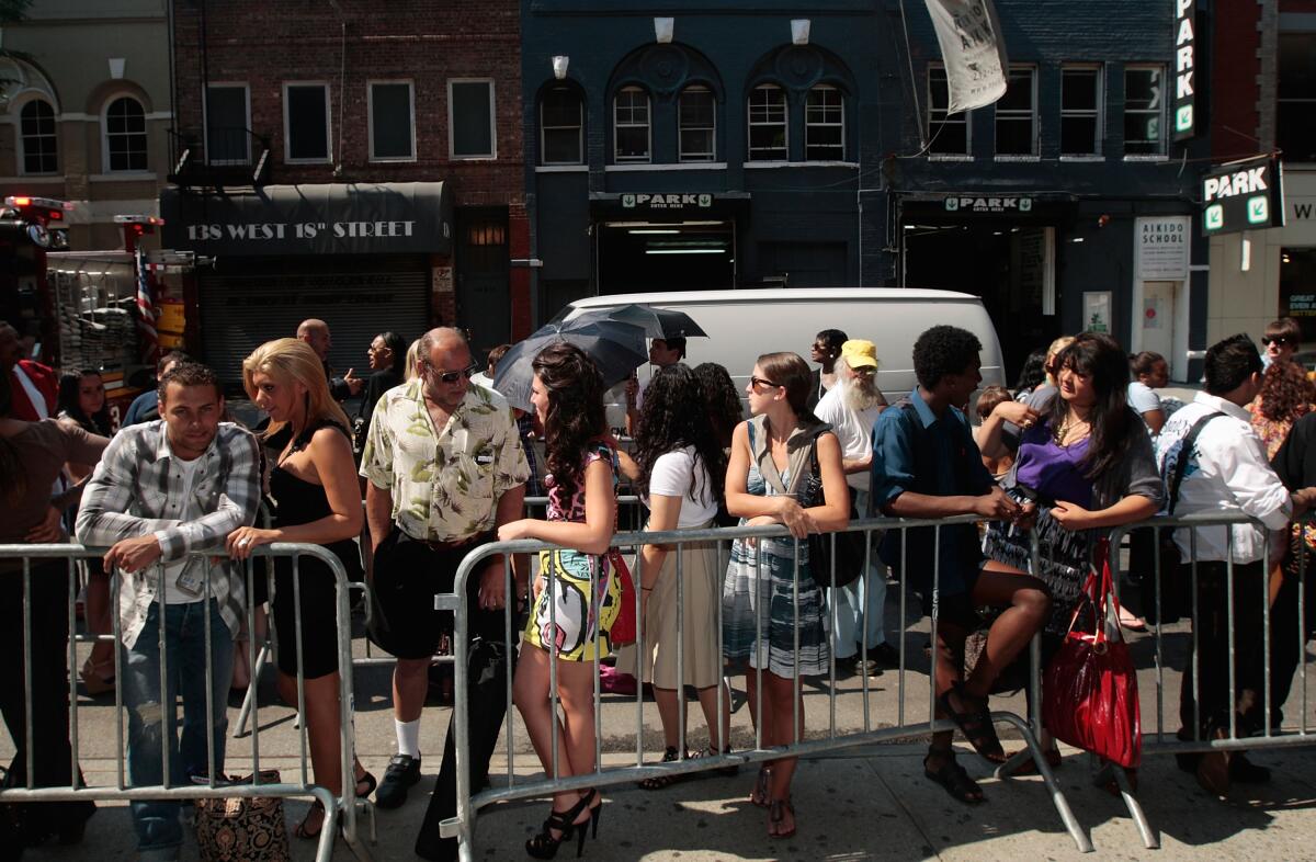 Hundreds of hopefuls stand in line to try out as extras for the movie "Sex and the City 2" in New York City. 