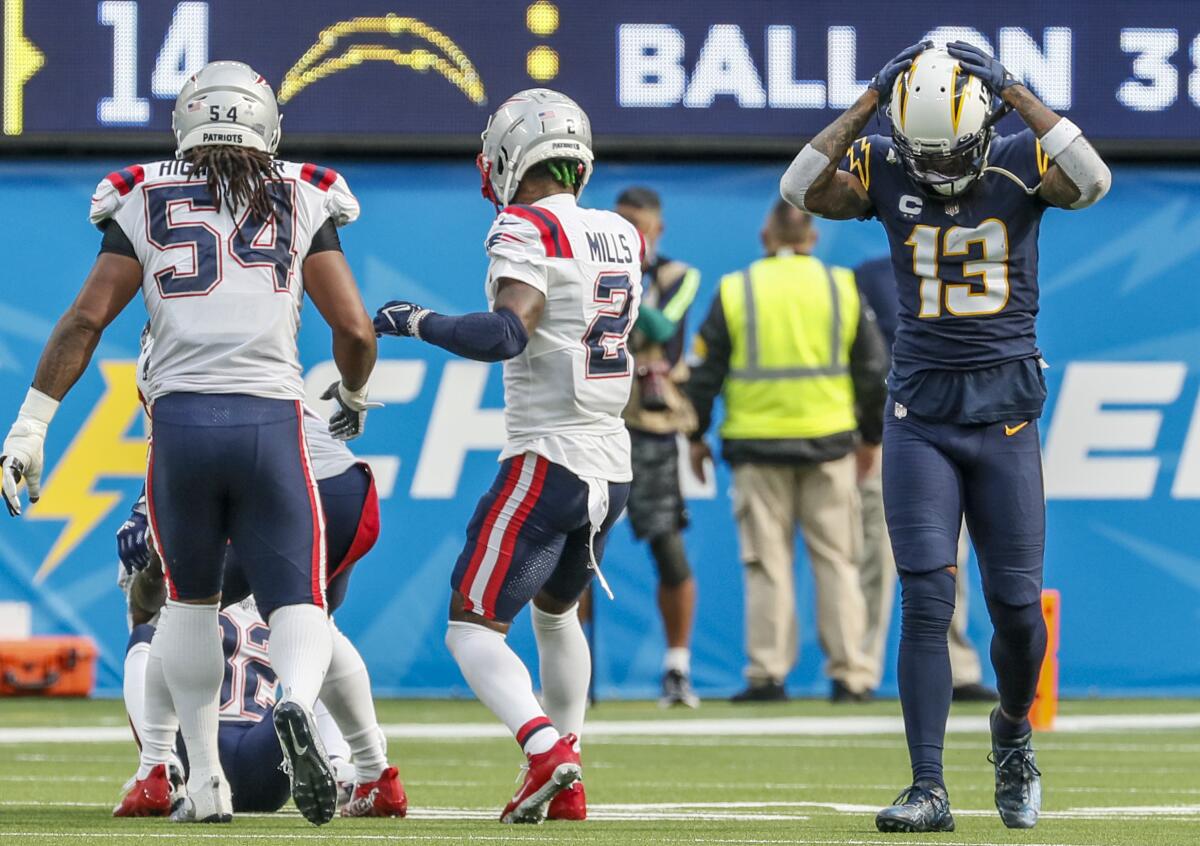 Chargers wide receiver Keenan Allen shows frustration after missing on a pass attempt from Justin Herbert at SoFi Stadium.