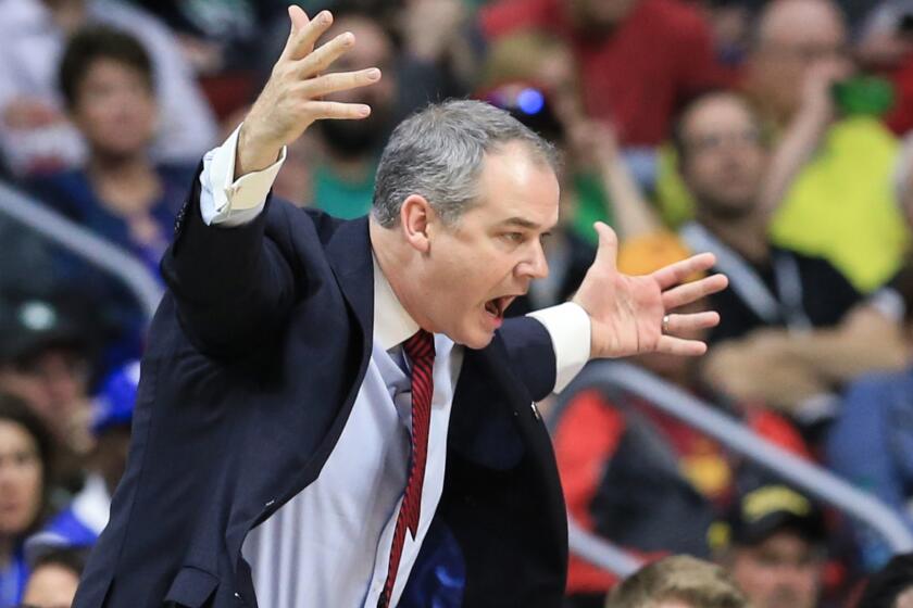 Coach Steve Pikiell yells instructions to his Stony Brook players during an NCAA tournament game against Kentucky on Thursday.