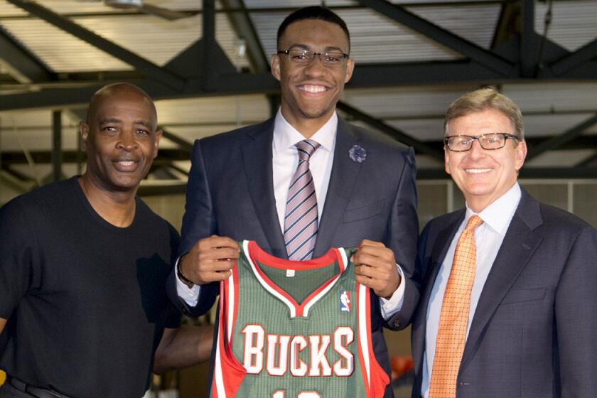 Less than a week after landing Duke's Jabari Parker, center, with the No. 1 draft pick, Bucks Coach Larry Drew, left, was out of job when General Manager John Hammond, right, and new ownership negotiated to bring in Jason Kidd as coach.