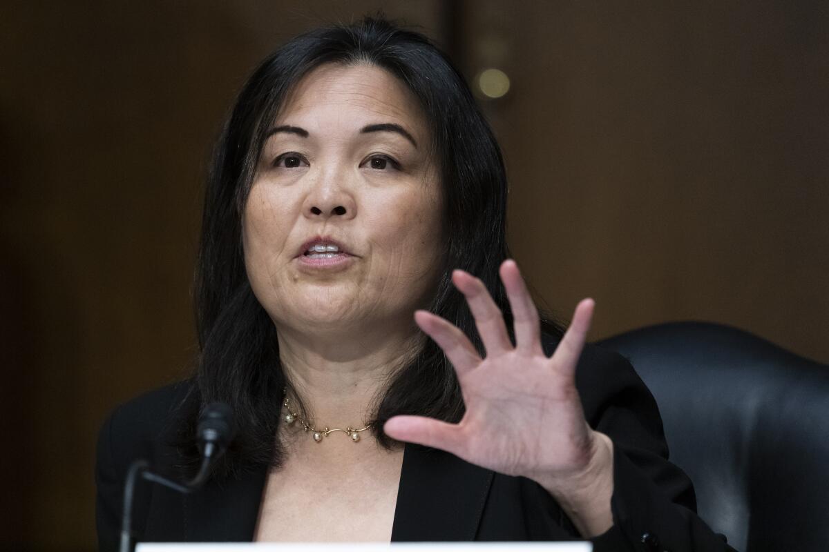 Julie Su speaks during a Senate committee hearing.