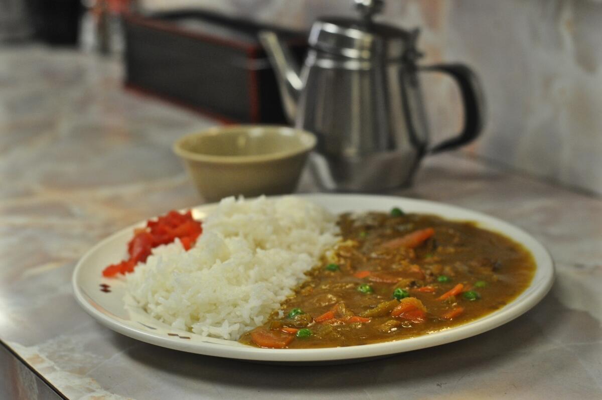 A plate of curry rice waits to be eaten at Mitsuru Cafe in L.A.'s Little Tokyo.