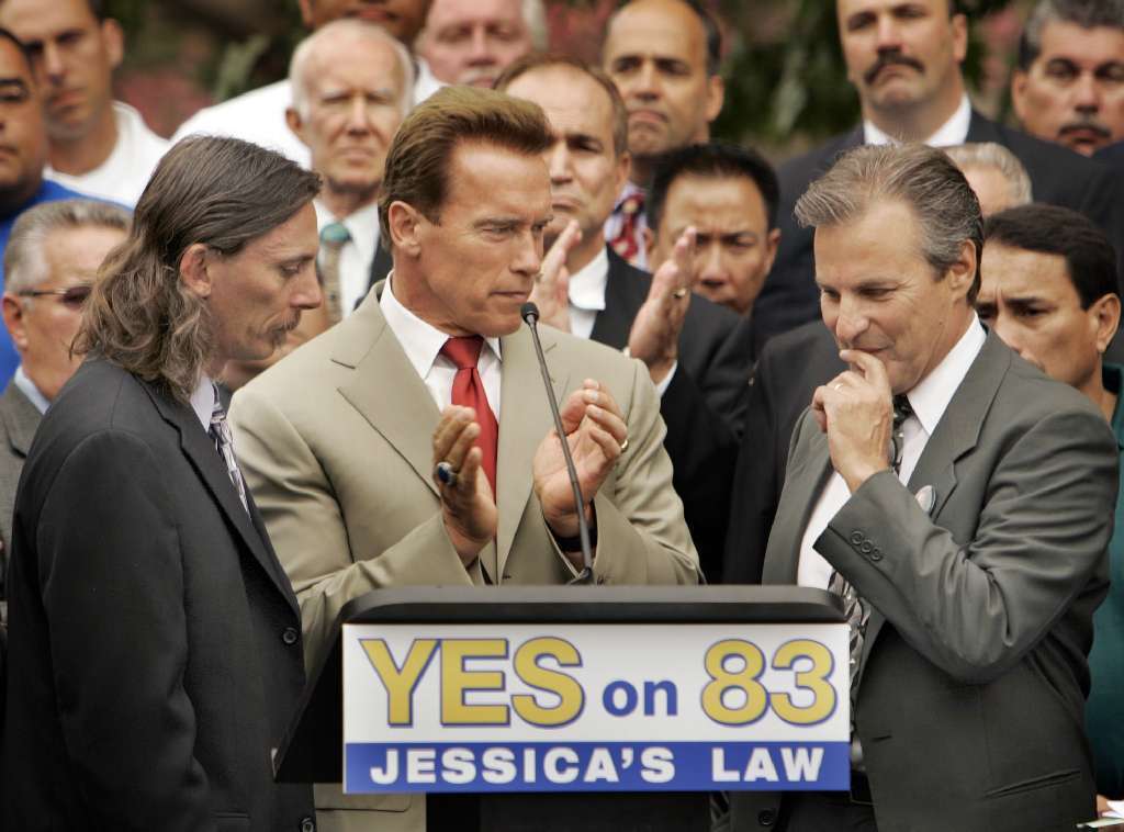 In 2006, Gov. Arnold Schwarzenegger was joined by Mark Lunsford, left, father of Jessica Lunsford, and Marc Klass, right, father of Polly Klass at a press conference to urge Californians to support Proposition 83, also known as Jessica's Law.
