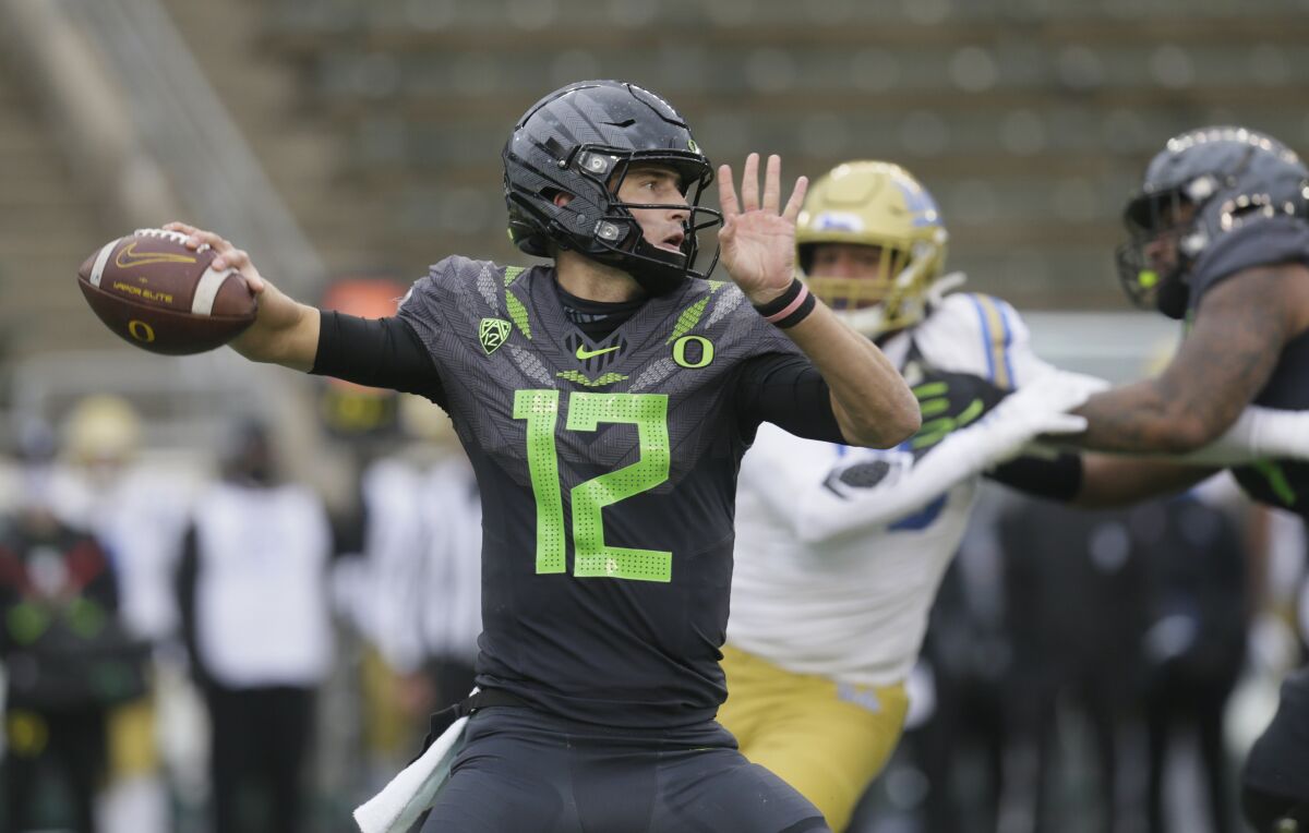 Oregon's Tyler Shough throws downfield against UCLA during the third quarter of an NCAA college football game Saturday, Nov. 21, 2020, in Eugene, Ore. (AP Photo/Chris Pietsch)