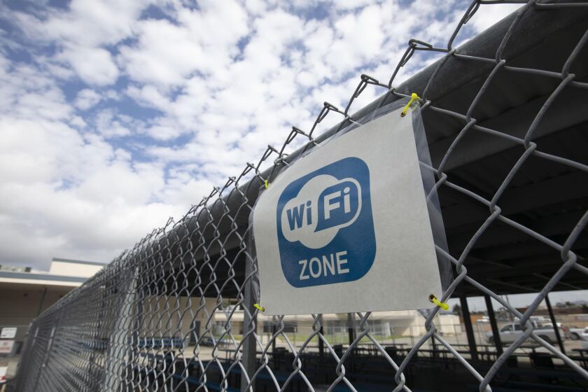 The School district has boosted the power of their internet signal so that students without home wifi can work from the parking lot at Del Dios Arts and Science Academy, a middle school. Photo taken on Friday April 17, 2020.