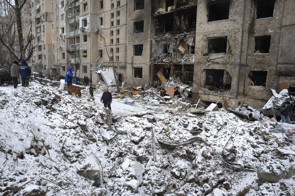 Crater outside Kyiv apartment building destroyed by Russian attack
