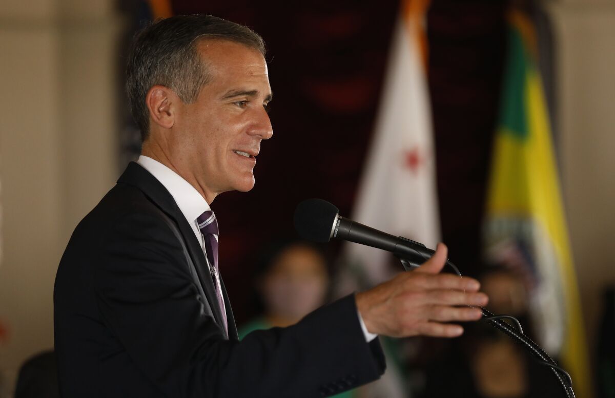 Eric Garcetti speaks at a microphone