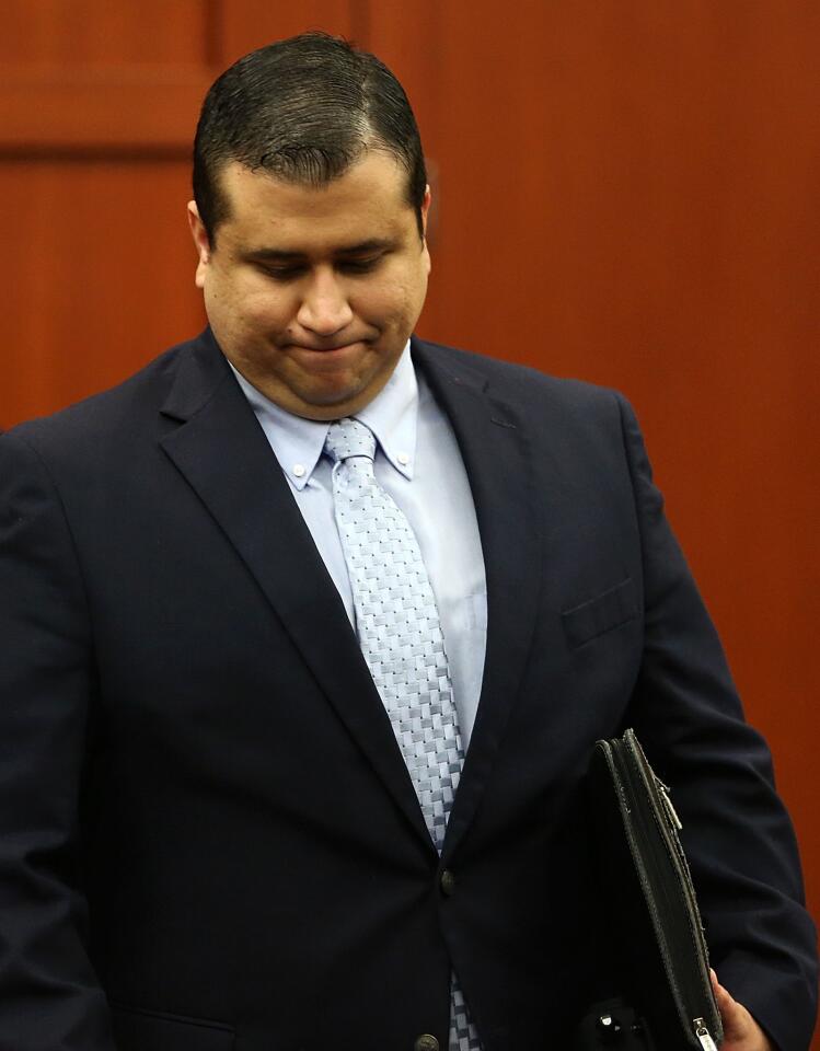 George Zimmerman leaves the courtroom at the end of the day during his trial in Seminole circuit court in Sanford, Fla. Friday, July 12, 2013. Zimmerman has been charged with second-degree murder for the 2012 shooting death of Trayvon Martin. The jury asked to recess until morning to continue deliberations.