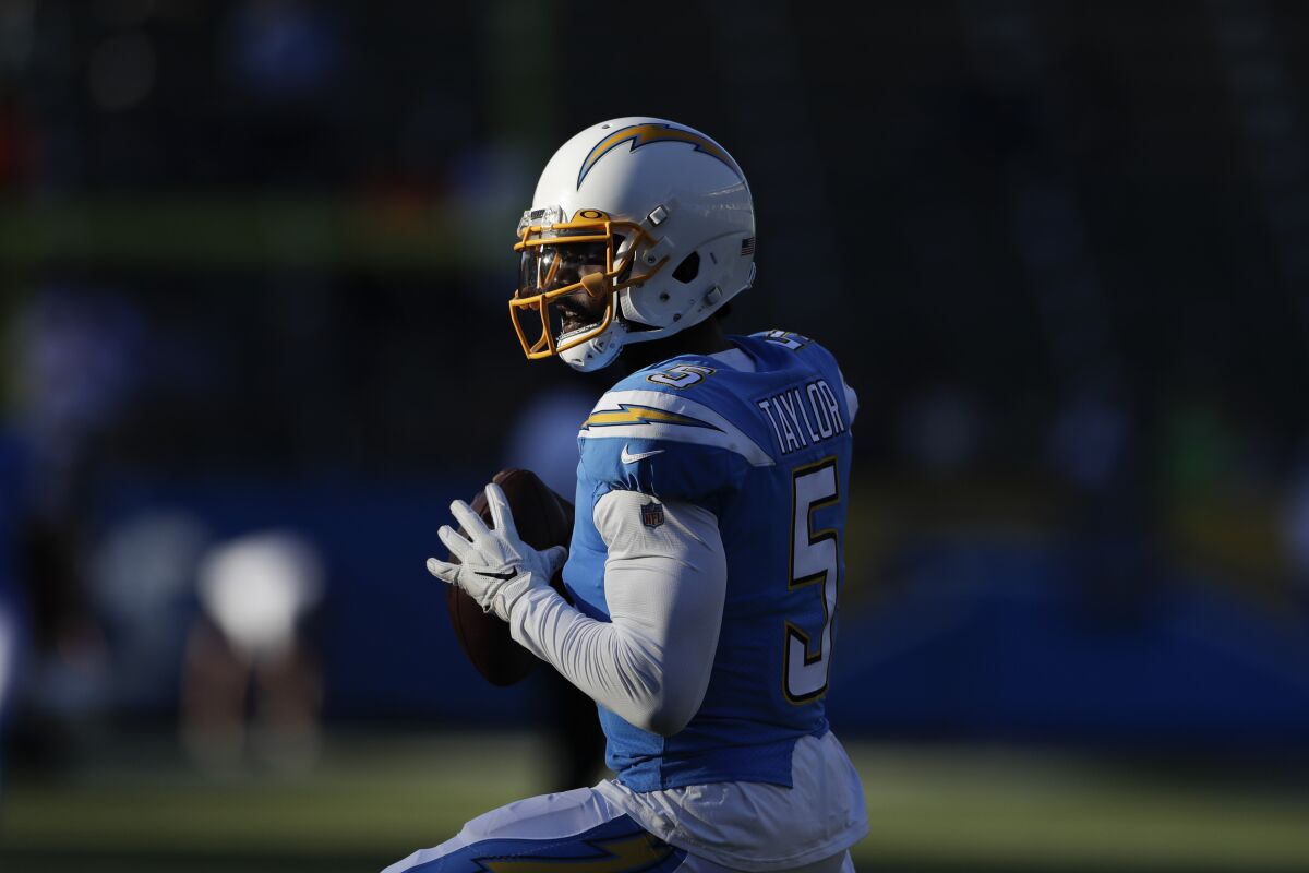 Chargers quarterback Tyrod Taylor warms up before a game.
