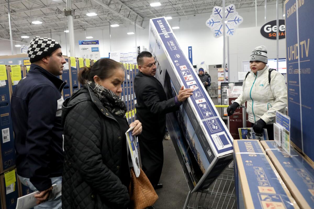 Shoppers at a Best Buy store. 