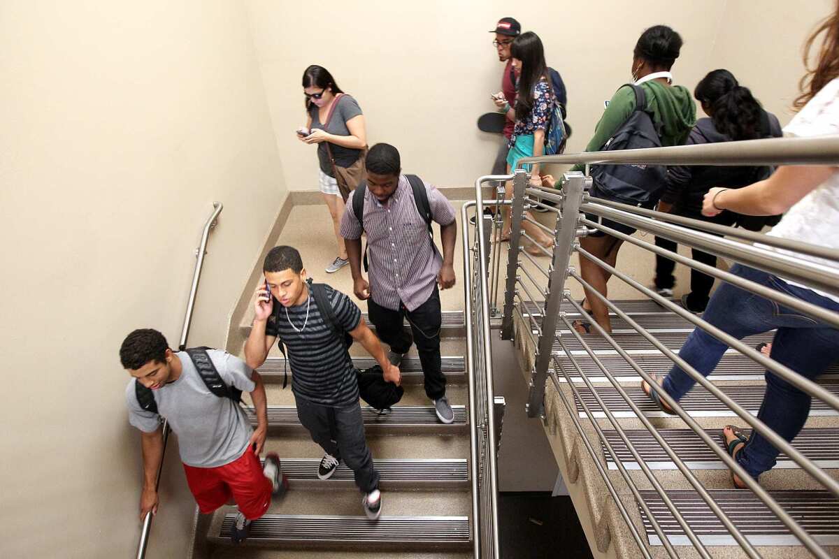 Jeffrey MacGillivray, 20, second from bottom left, heads out after his philosophy class in 2012 at El Camino Community College in Torrance. "I was thinking I can just go to community college, do my two years and transfer," MacGillivray said. "I had no idea I'd probably end up at El Camino for four years."