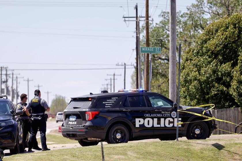 Police investigate after people were found dead in a home in Oklahoma City on Monday, April 22, 2024. Oklahoma City police called to a home on the city's southwest side Monday discovered the bodies of five people, including at least two children, authorities said. (Nathan J. Fish/The Oklahoman via AP)