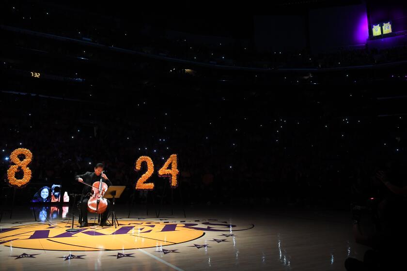 LOS ANGELES, CALIFORNIA JANUARY 31, 2020-Ben Hong plays the cello during the Lakers pregame ceremony to honor Kobe Bryant at the Staples Center Friday. (Wally Skalij/Los Angeles Times)