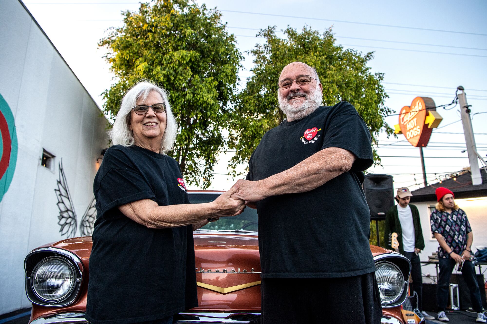 Jeanie and Tony Pinto pose next to their 1957 Chevy Bel Air