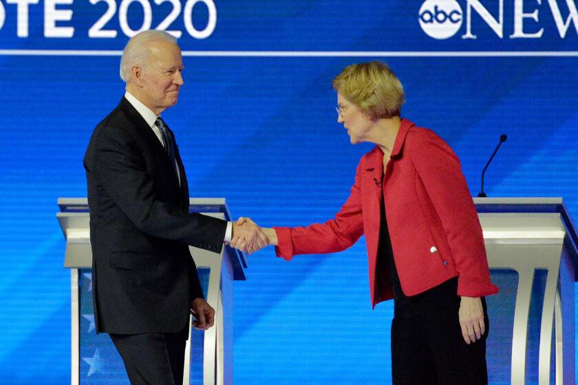 Democratic presidential hopeful former Vice President Joe Biden shakes hands with Massachusetts Senator Elizabeth Warren as they arrive for the eighth Democratic primary debate of the 2020 presidential campaign season co-hosted by ABC News, WMUR-TV and Apple News at St. Anselm College in Manchester, New Hampshire, on February 7, 2020. (Photo by Joseph Prezioso / AFP) (Photo by JOSEPH PREZIOSO/AFP via Getty Images)