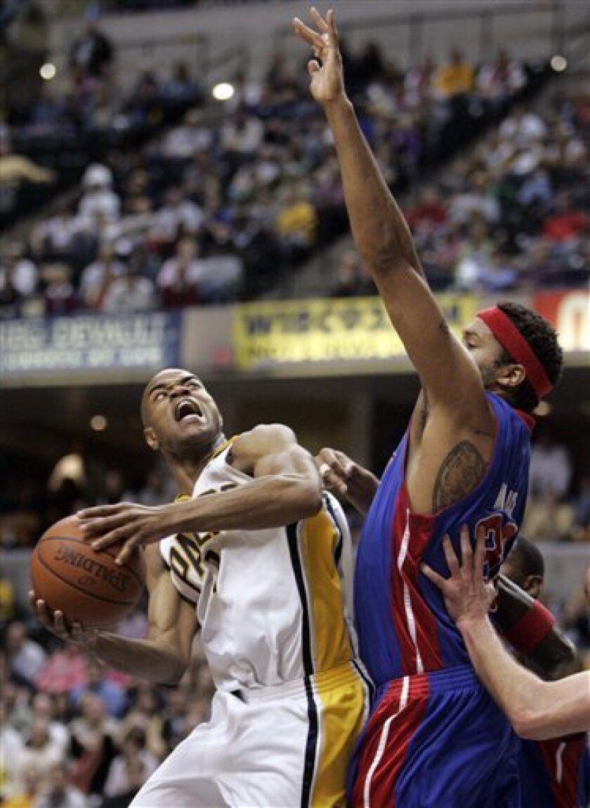 Indiana Pacers' Jarrett Jack, left, grimaces as he's fouled by Detroit Pistons' Rasheed Wallace in the second half of a NBA basketball game in Indianapolis, Saturday, April 11, 2009. The pacers defeated the Piston 106-102. (AP Photo/Michael Conroy)
