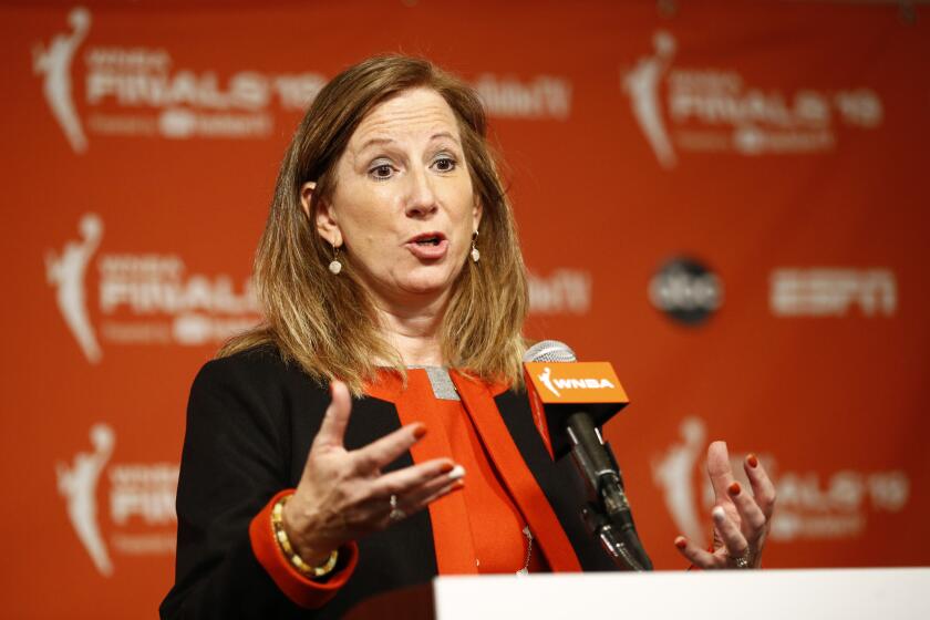 FILE - In this Sept. 29, 2019, file photo, WNBA Commissioner Cathy Engelbert speaks at a news conference before Game 1 of basketball's WNBA Finals between the Connecticut Sun and the Washington Mystics, in Washington. The WNBA has announced plans to play a reduced season, with a 22-game schedule that would begin in late July without fans in attendance. “There’s a lot to do between now and the tip of the season, now that we’ve selected IMG Academy” as the location to play, WNBA Commissioner Cathy Engelbert said in a phone interview Monday, June 15, 2020. (AP Photo/Patrick Semansky, File)