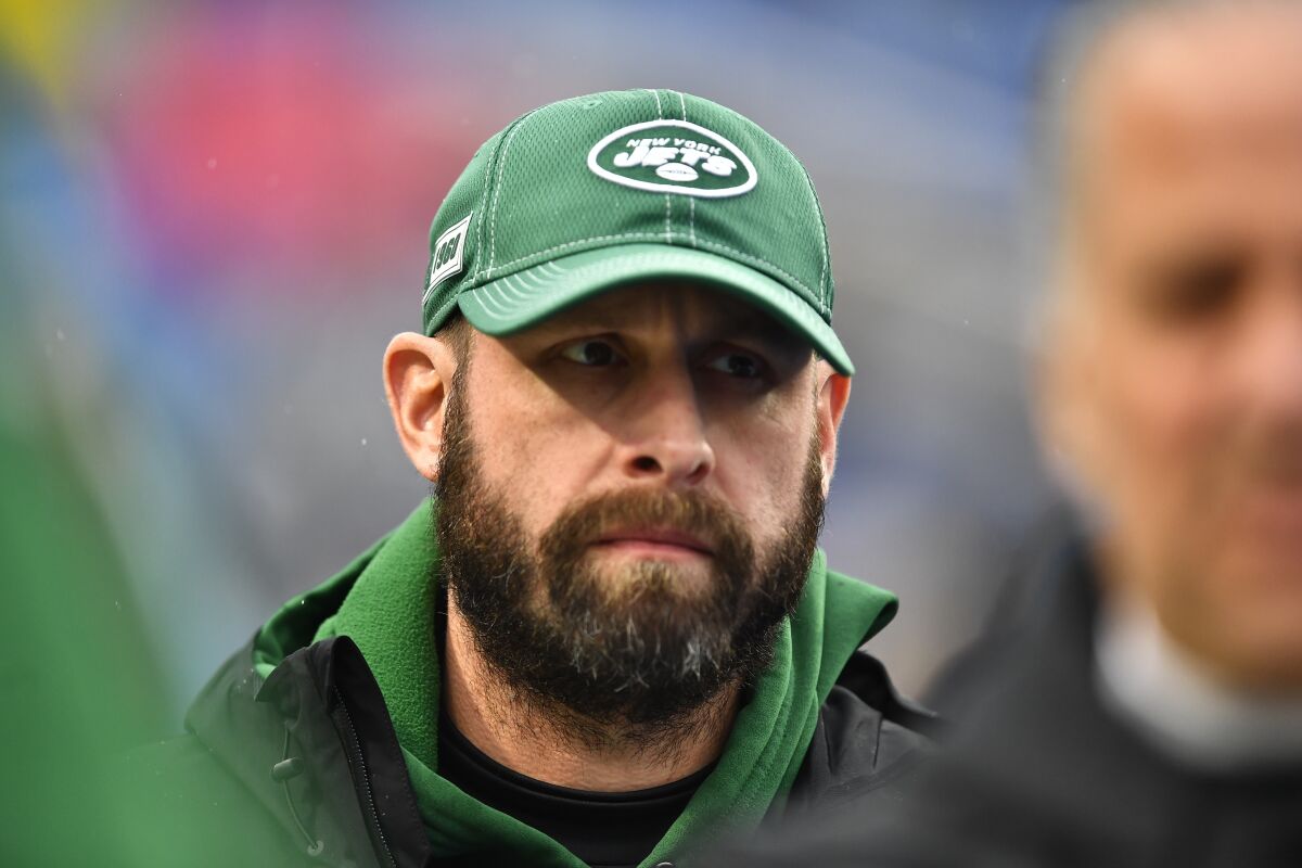 FILE - New York Jets head coach Adam Gase walk the field as his team warms up before an NFL football game against the Buffalo Bills Sunday, Aug. 26, 2018, in Orchard Park, N.Y. The heat is on — and the games haven't even kicked off yet. That's life in the NFL for some coaches who enter the regular season knowing they need to guide their squads through what will be a most unusual regular season and at least keep them in playoff contention into December. (AP Photo/Adrian Kraus, File)