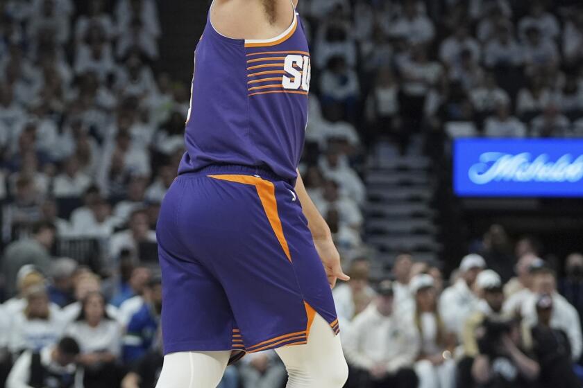 Phoenix Suns guard Grayson Allen stands on the court after missing a shot during the first half of Game 1 of an NBA basketball first-round playoff series against the Minnesota Timberwolves, Saturday, April 20, 2024, in Minneapolis. (AP Photo/Abbie Parr)