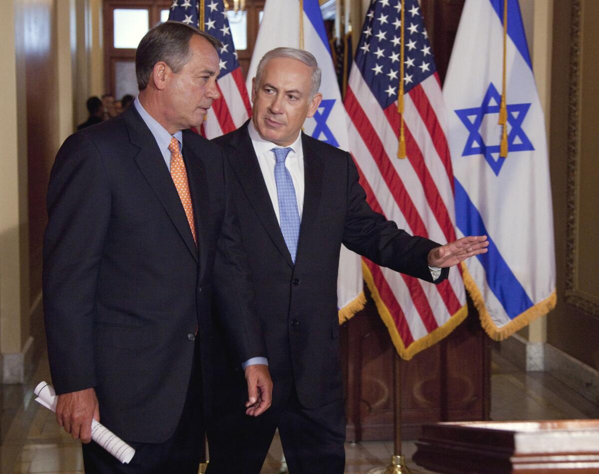 Israeli Prime Minister Benjamin Netanyahu walks with House Speaker John Boehner to make a statement in Washington in May 2011. Boehner has invited Netanyahu to Capitol Hill again.