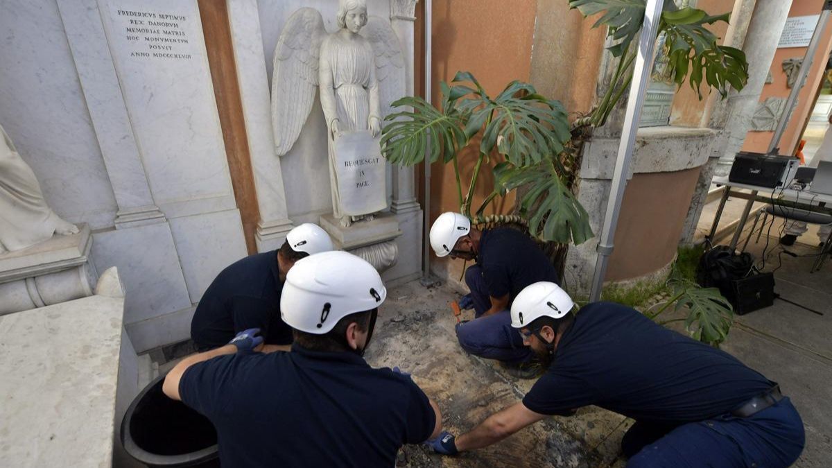 Workers open a tomb in the cemetery of the Pontifical Teutonic College in Vatican City on Thursday during a renewed search for the remains of Emanuela Orlandi, a daughter of a Vatican employee who disappeared at age 15 in 1983.