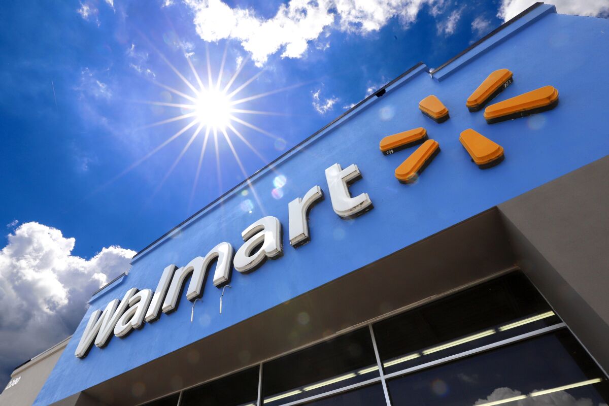 FILE - This June 25, 2019, file photo shows the entrance to a Walmart in Pittsburgh. Walmart is spreading out its traditional one-day Black Friday deals over three weekends in November 2020 in an effort to reduce crowds in its stores amid the coronavirus pandemic. (AP Photo/Gene J. Puskar, File)