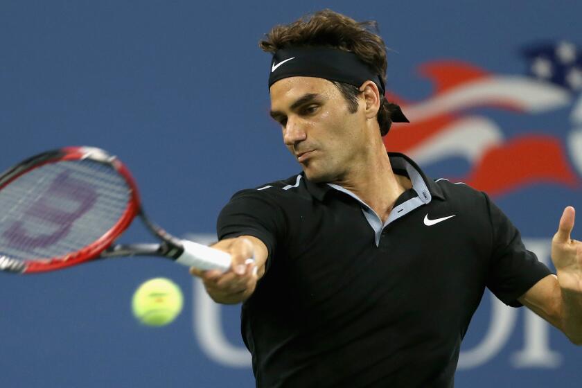 Roger Federer returns a shot during his fourth-round victory over Roberto Bautista Agut at the U.S. Open on Tuesday.