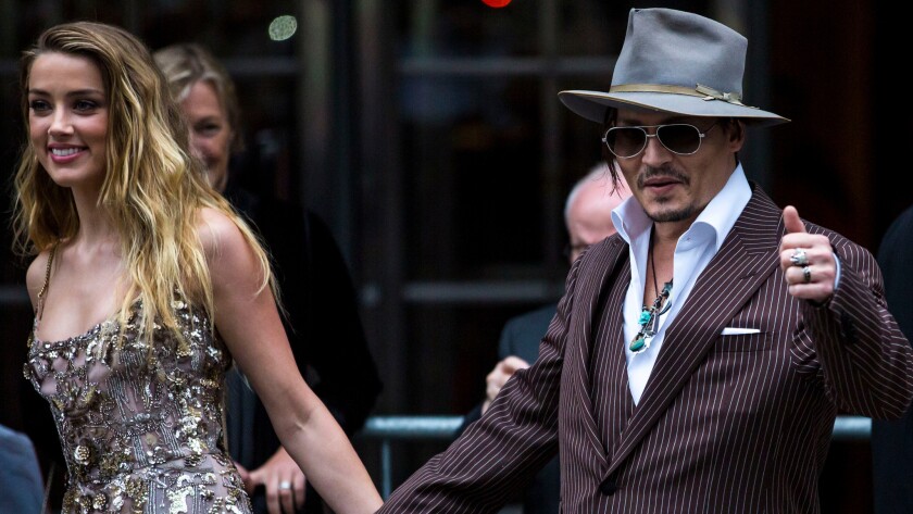 Actress Amber Heard and Johnny Depp attend the premiere of "The Danish Girl" last year. Heard filed for divorce on Monday.