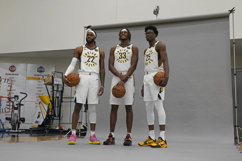 Indiana Pacers' Isaiah Jackson (22), Myles Turner (33) and Jalen Smith (25) pose for a photograph at the NBA basketball team's media day, Monday, Sept. 26, 2022, in Indianapolis. (AP Photo/Darron Cummings)