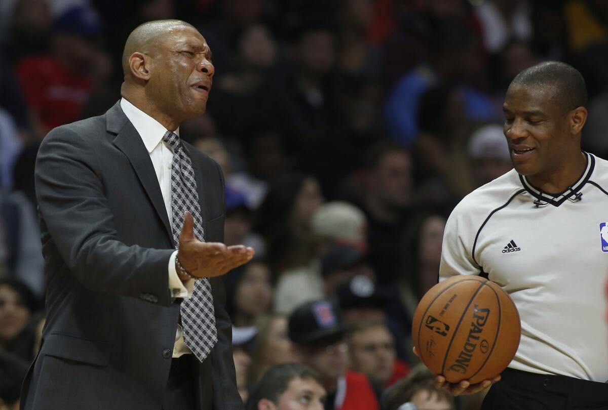 Clippers Coach Doc Rivers, left, argues a call in fourth quarter on Friday.