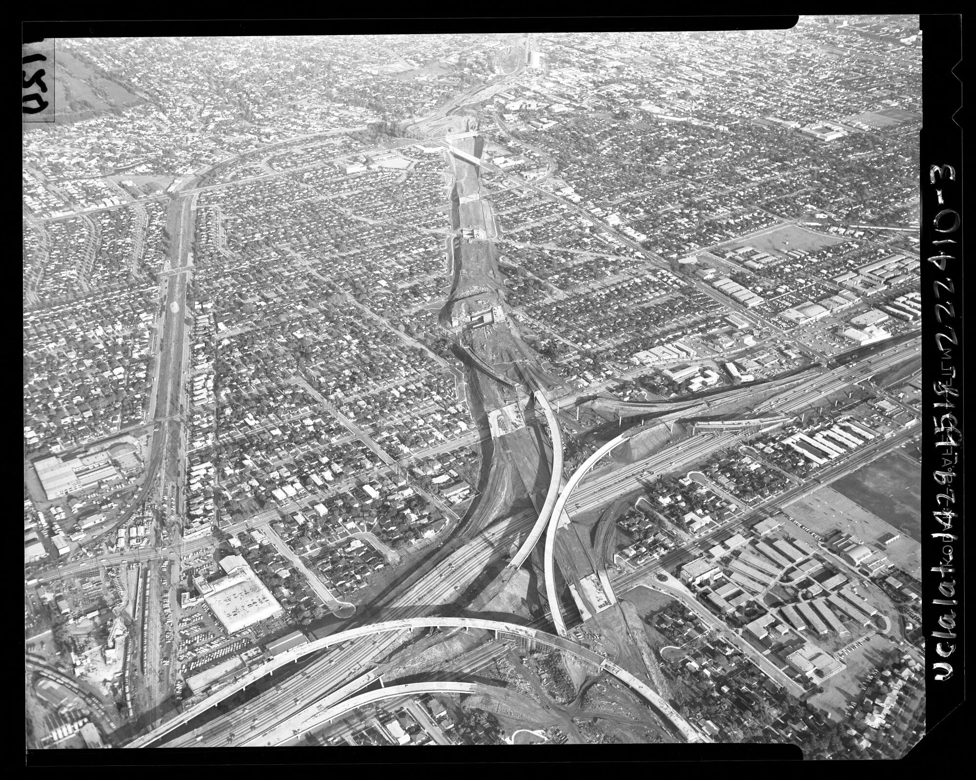 A view of the interchange where the Santa Monica Freeway is being built across the path of the San Diego Freeway in 1963.