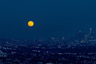 The blue moon rising over Los Angeles.