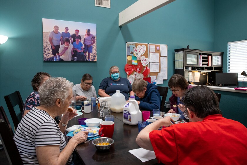 HGH residents, staff eat Feb. 17 at a home where they lived six months while awaiting repairs at the Greencastle Street home.