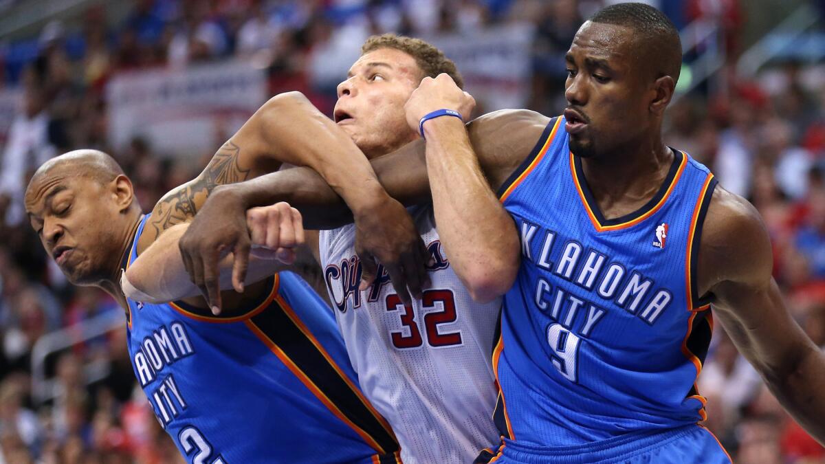 Clippers power forward Blake Griffin, center, battles for position against Oklahoma City Thunder teammates Caron Butler, left, and Serge Ibaka during the Clippers' win in Game 4 of the Western Conference semifinals Sunday.
