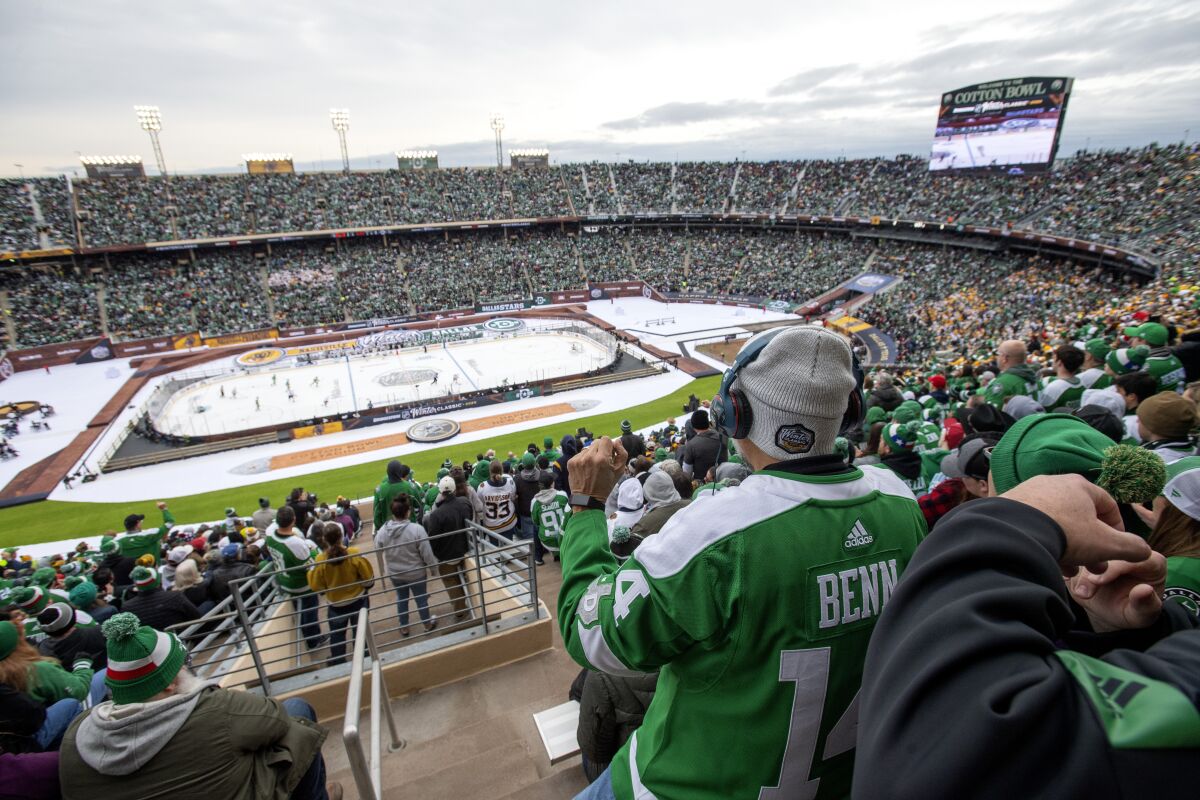 Fans watch the NHL Winter Classic game between the Dallas Stars and Nashville Predators on Jan. 1 at the Cotton Bowl